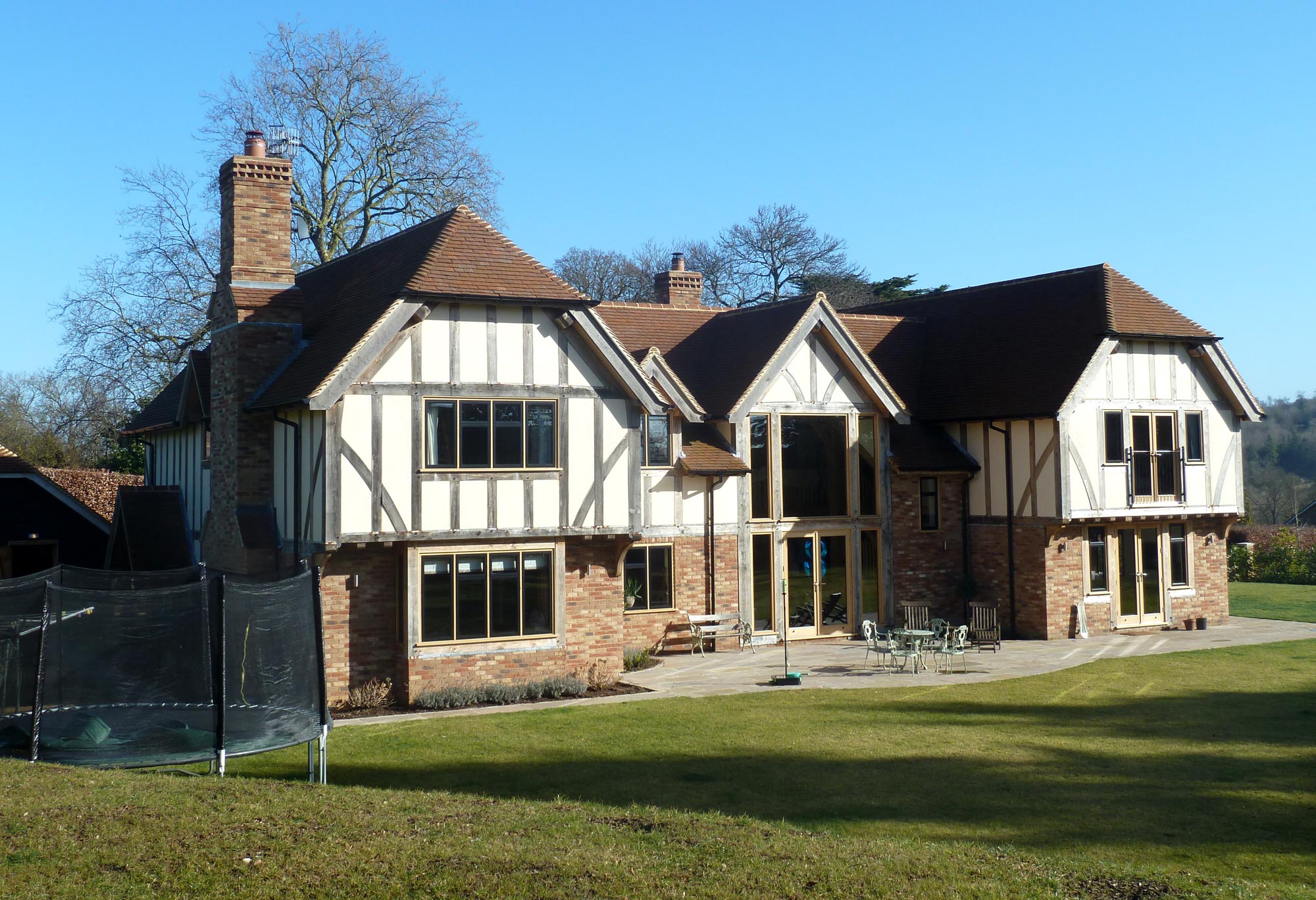 Exterior rear view of new Oak Frame house - Castle Eaton Construction, Surrey