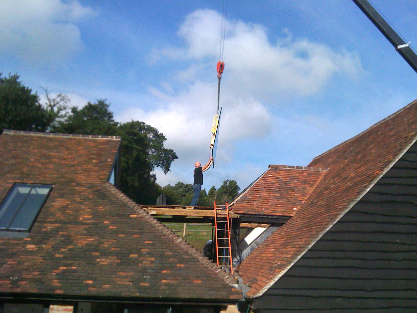 Glazing being installed by crane - Castle Eaton Construction