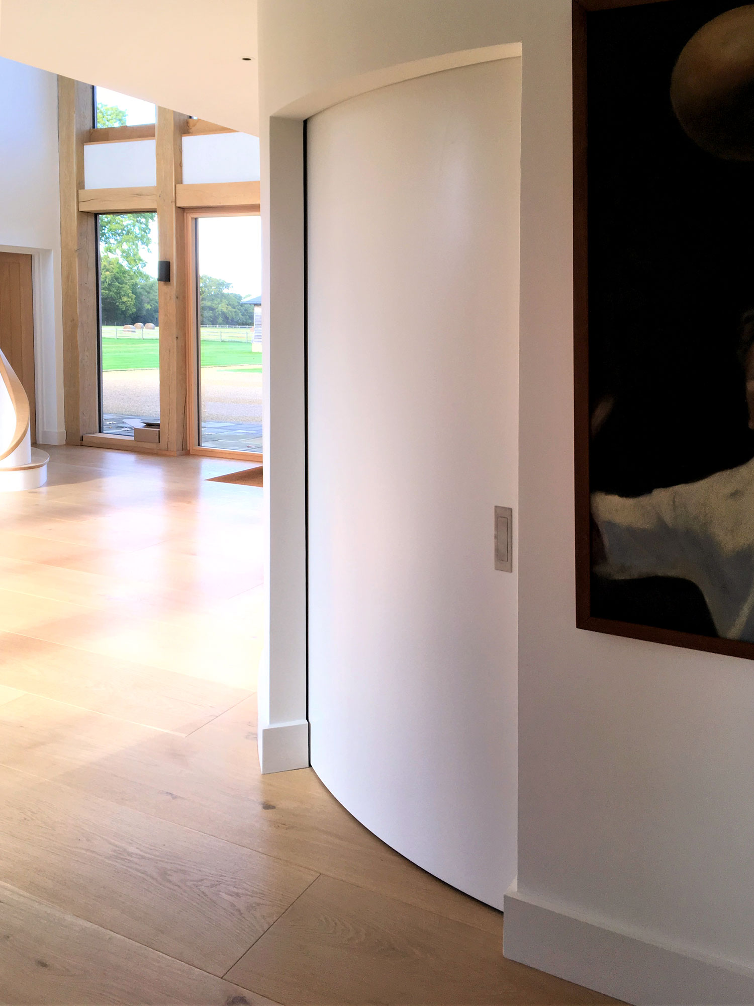 Interior with curved sliding wall closed - Castle Eaton Construction, Surrey